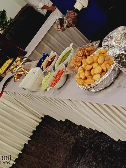 All the essential ingredients for a perfect pani puri station. I provide fresh puri, different fillings, and flavorful water, all neatly arranged for your guests.