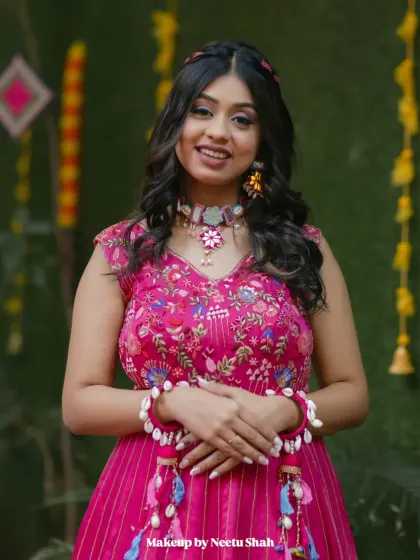 A happy and confident portrait of the bride. The soft glam makeup enhances her features while keeping the look fresh and appropriate for a daytime event.