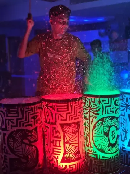 The vibrant colors of the LED liquid drums. Each drum lights up in a different color, creating a dynamic and visually engaging performance.