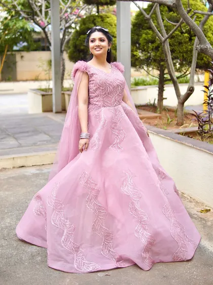 A princess moment in this beautiful pink gown. The makeup is soft and romantic, with a subtle glow and a matching pink lip.