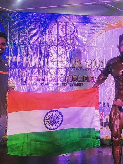 Holding the Indian flag with my uncle after qualifying for a major event. This moment represents the culmination of a successful competition prep and a proud achievement.