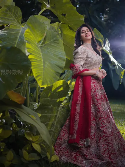 A full length shot of Mahima in the garden. Her makeup completes a look of timeless elegance, proving that glamour can also be soft and natural.
