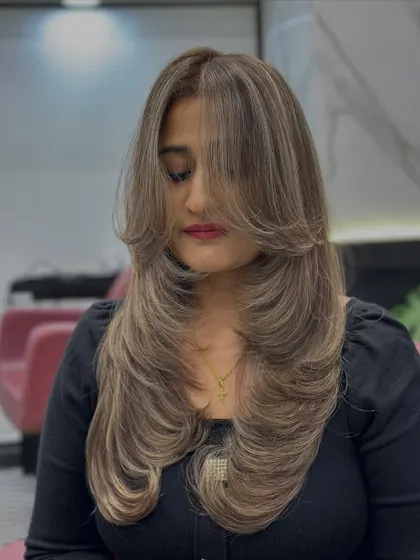 Another angle of the ash blonde perfection, with soft face-framing layers.