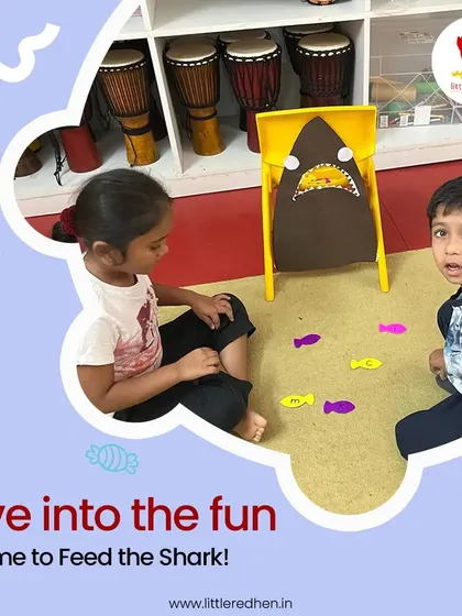 A close-up of the 'Feed the Shark' game, a favorite during our summer camp. The excitement on the children's faces says it all.