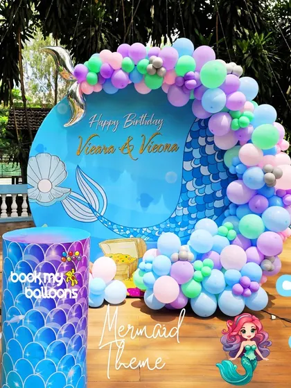 Vieara and Viona celebrated their birthday with this gorgeous mermaid theme. The centerpiece was a large circular backdrop with a mermaid tail design, framed by a beautiful organic balloon arch in pastel colors.