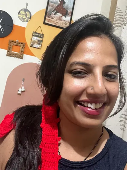 A selfie showing how I style the red bow hair tie. It’s a fun and easy way to add some flair.