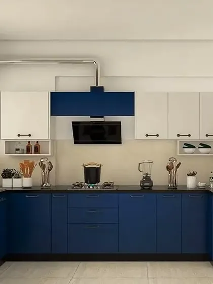 A bold U-shaped kitchen with royal blue base cabinets and white uppers. The exposed chimney pipe is an industrial-chic detail that adds character to the space.