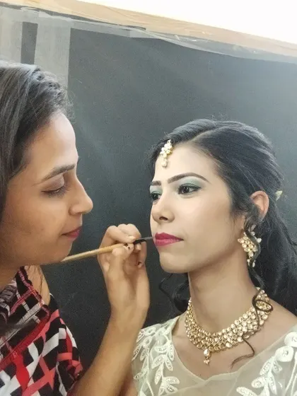 In action, applying the finishing touches to a client's lip makeup. My focus is always on precision and ensuring my client feels comfortable and happy.