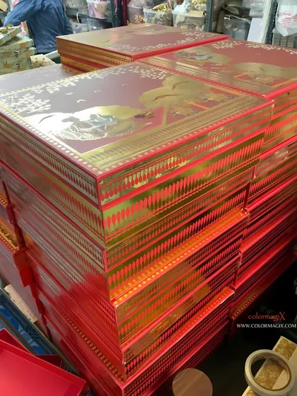 A stack of our vibrant red and gold wedding boxes. This classic color combination is perfect for traditional Indian weddings, bringing a sense of opulence and celebration.