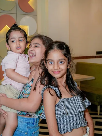 Siblings and friends having fun and posing for the camera.