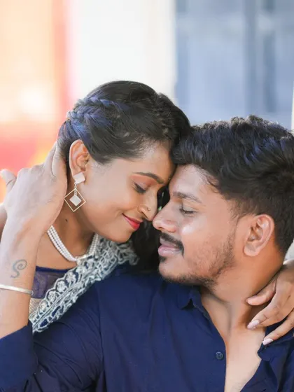 A close-up, intimate portrait of a couple. I focus on capturing the deep connection and emotion between two people.