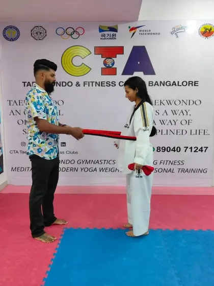 Presenting a red belt.