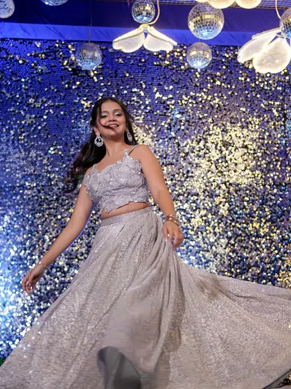 A fun, twirling shot that shows off the movement of her lehenga and her dazzling makeup.