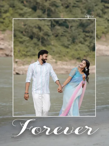 A happy, candid shot of a couple walking hand-in-hand by the river, with the word 'Forever' elegantly scripted.