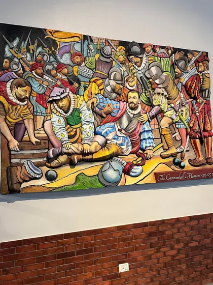 An angled view of the finished mural, showing how the bright colors and 3D forms pop against the wall.