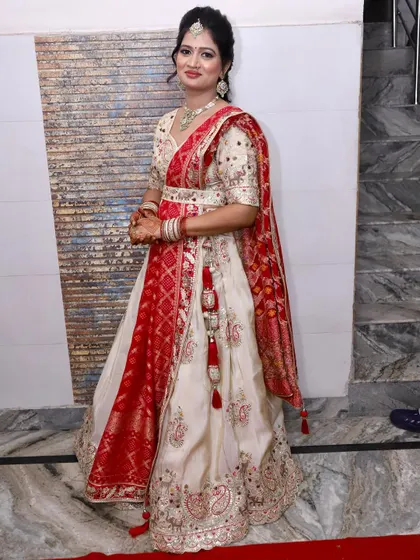 A poised photo showing the full detail of her lehenga and the neatly draped dupatta.