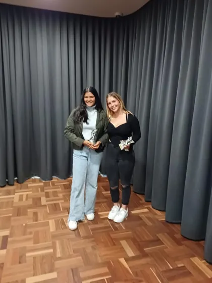 Arya celebrating her Best Batter award with a teammate. We foster an environment where our players can succeed both at home and abroad, building skills that travel.