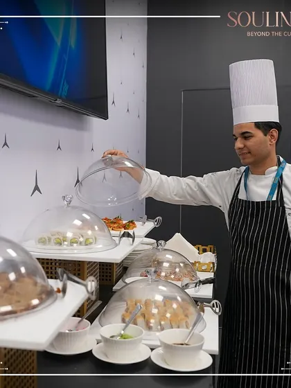 Our chef overseeing the buffet at a corporate pavilion, ensuring every dish is perfectly presented. We maintain the highest standards of quality and service throughout any event.