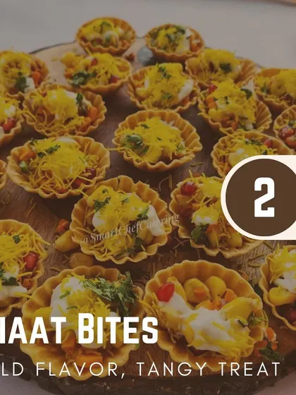 My chaat bites are a modern take on a classic favorite. Served in crispy tart shells and topped with sev and pomegranate, they are a burst of flavor in every bite.