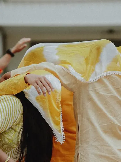 A duplicate of the playful moment under the cloth, a sweet and intimate part of the ritual.
