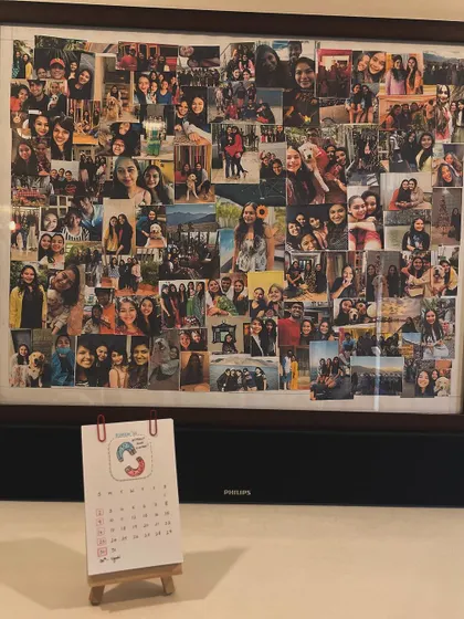 Placed in a memory corner, my calendar sits below a large photo collage, marking the days alongside cherished moments.
