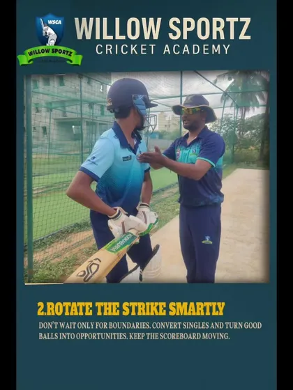 A coach gives a batsman personalized advice during a net session. We focus on smart strike rotation and keeping the scoreboard moving as key batting strategies.