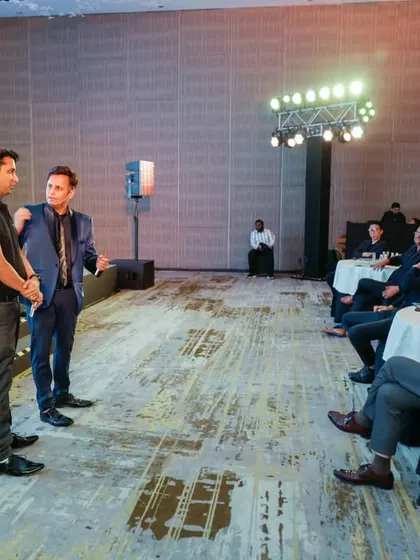 A moment of interaction with a volunteer at the Panasonic Partner's Meet. These unscripted moments often become the most memorable parts of the show for the audience.