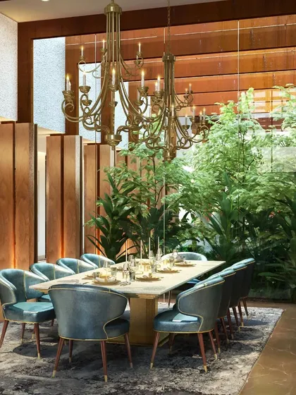 A luxurious dining room with an indoor garden, showcasing our belief that nature is a timeless influence in interior design.