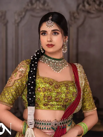 A close-up of the model's serene expression, highlighting the beautiful Kundan choker and maang tikka. This set is perfect for achieving a subtle yet glamorous look.