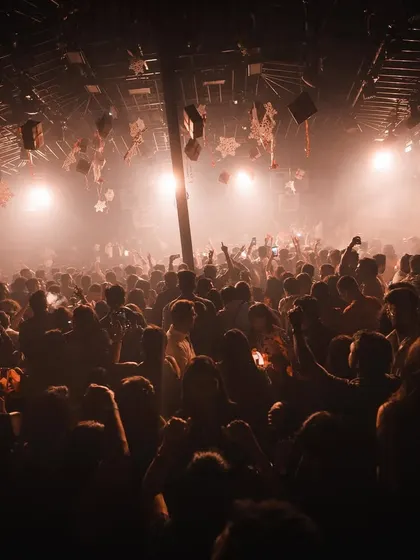 An atmospheric shot of the dense crowd at Hammerzz, lost in the music under warm lights.