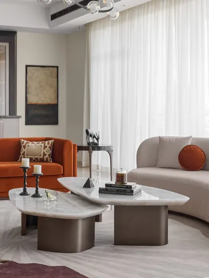 A furniture collaboration with Sreya Seth Design, this living room features our custom pieces, including the nested marble coffee tables and the burnt orange sofa, creating a space that is both elegant and full of personality.