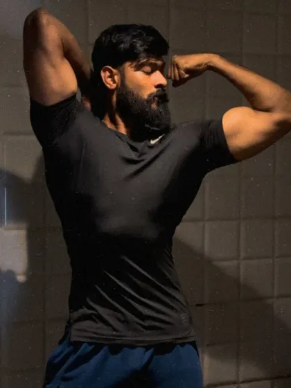 A classic bodybuilding pose, showcasing the bicep peak and back width.