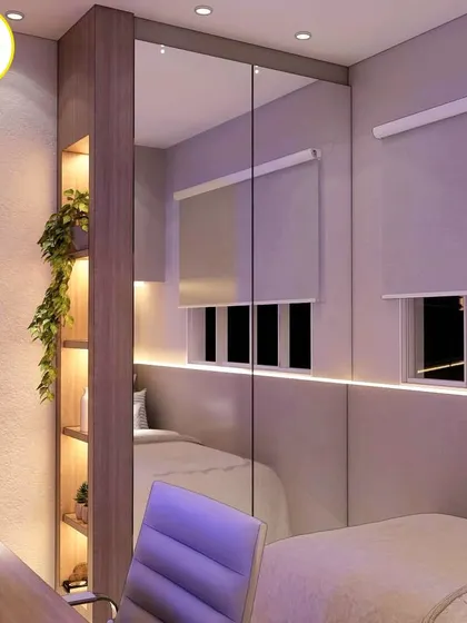 The mirrored wardrobe reflects the room, creating an illusion of depth and space.
