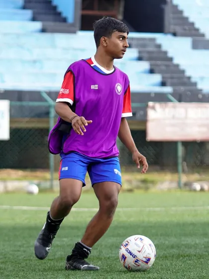 A young athlete maintains control of the ball while on the move. Our program emphasizes dynamic ball mastery and agility.