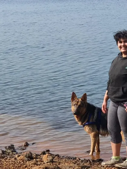 My partner sharing a moment with Jiraiya at the water's edge. My sessions are all about capturing the genuine connection you have with your pet in a relaxed, outdoor setting.