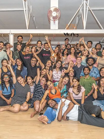 This is what our community looks like. A group photo from our Motley Mixer, filled with happy smiles and good energy. This is our dance tribe.