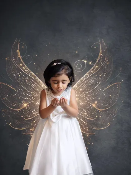 A little angel with magical, sparkling wings. We use creative editing to add a touch of magic and wonder to our photoshoots, turning a simple portrait into a piece of art.