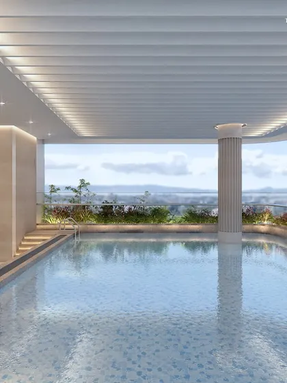The indoor pool at our Nagpur residence offers a serene escape with panoramic views. The design uses clean lines, classical columns, and soft lighting to create a tranquil space for year-round enjoyment.