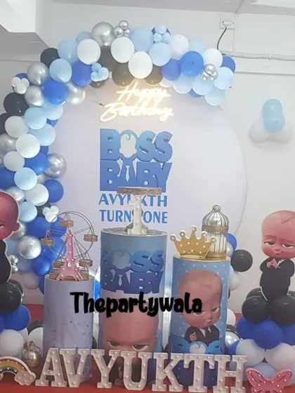 A Boss Baby theme with a large backdrop and character cutouts, perfect for a grand first birthday celebration.