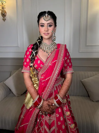 A close-up shot of our Sikhni bride, her subtle makeup perfectly highlighting the beauty of our polki choker and maang tikka.