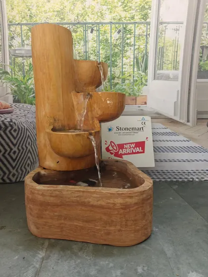 This angle of the cascading fountain shows the natural, wood-like texture of the Teak Sandstone, which is entirely natural stone.