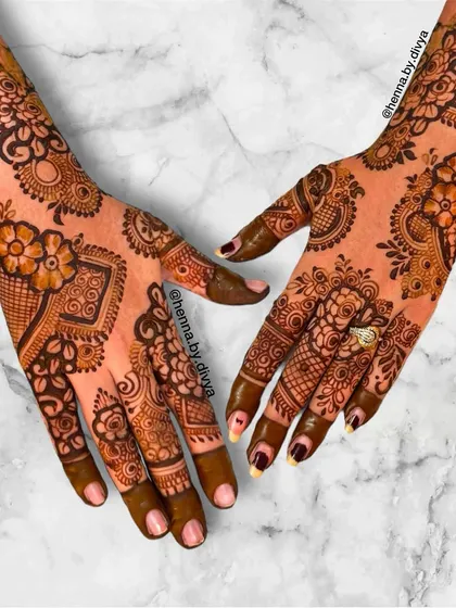 I call this my designer Indo-Western mehendi. It combines various elements like florals, paisleys, and geometric shapes in a non-symmetrical layout for a truly unique and artistic statement.