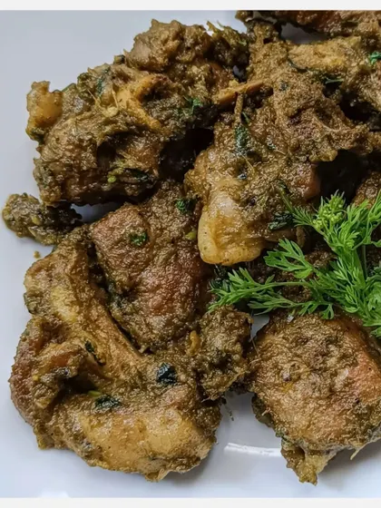 A close-up of my Karnivore Bannur Mutton Fry. You can see the texture of the slow-cooked meat and the rich, coriander-based masala clinging to each piece.