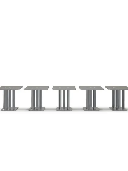 The XOXOX table features a square tabletop and five "X" and "O" shaped legs. This product shot highlights the design's balance of a sturdy, industrial feel with a playful and elegant silhouette.