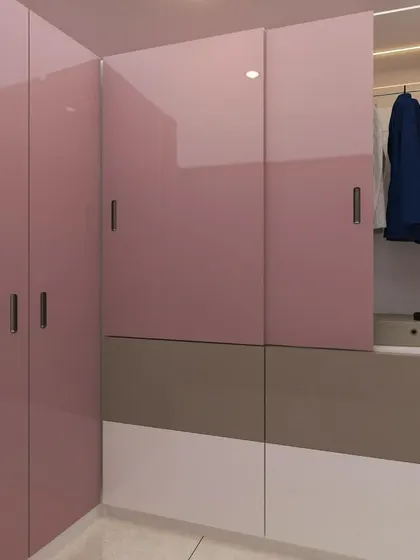 A 3D render of a daughter's room in shades of pink. This image shows a corner wardrobe with glossy pink shutters, part of a complete room design.