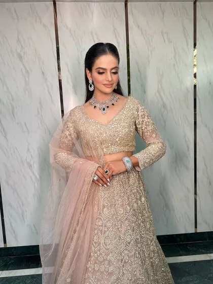 A full shot of the bride, her outfit and jewellery creating a breathtaking combination.