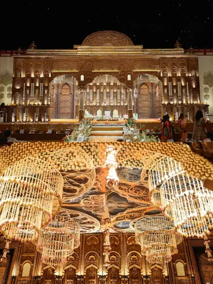 A collage showing the grand mandap and the intricate floral chandeliers, capturing the essence of this regal South Indian wedding.