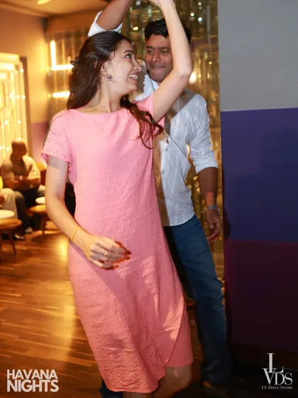 That smile says it all! A beautiful, candid moment of a couple enjoying a dance, with the woman's face lit up with joy. Our socials are all about creating happy memories.