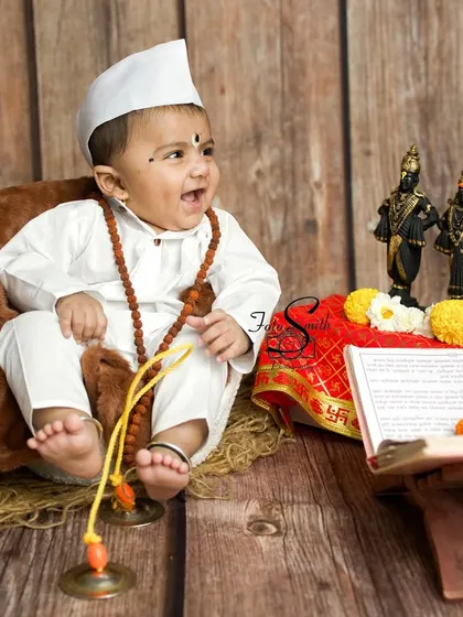 A joyful laugh from this little devotee. Capturing these spontaneous moments of happiness is what makes my work so rewarding.