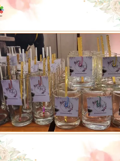 A collection of glassware with custom tags and colorful stirrers, showcasing the small details that make a big impact.
